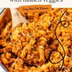 Skillet of ground turkey pasta with spiral noodles, red sauce, grated cheese, wooden spoon, and recipe text overlay.
