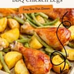 Sheet pan with BBQ chicken legs, roasted potato wedges, and green beans for a simple one-pan dinner.