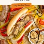 Sheet pan with cooked sausages, bell peppers, onions, sandwich bun with mustard, and a bowl of grainy mustard.