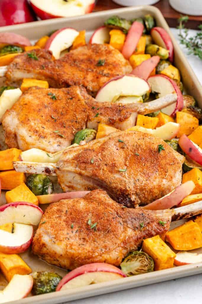 Sheet pan pork chops with apples, Brussels sprouts, and sweet potatoes.