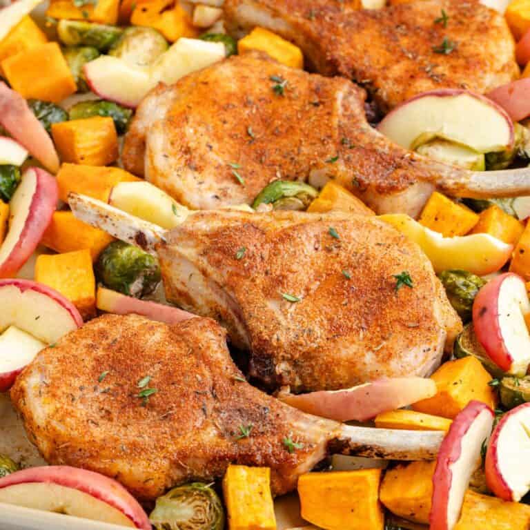 Baked pork chops with apples, sweet potatoes, and Brussels sprouts.