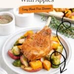 Plate with baked pork chop, roasted apples, Brussels sprouts, potatoes, and text: “Baked Pork Chops With Apples.”.