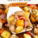 Sheet pan with cooked chicken, pineapple, bell peppers, onions, and carrots. Text: Hawaiian Chicken Sheet Pan Meal.